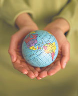 Hands holding globe