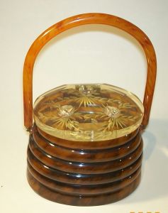 An original Llewyln 1950s Lucite Beehive Handbag with studded metal bees