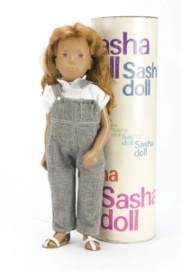 A Trendon Sasha doll with red hair grey dungarees