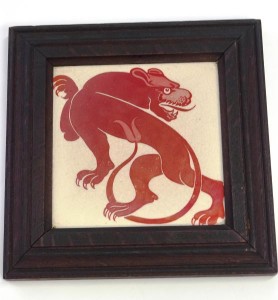 A William de Morgan pottery tile with a mythical beast