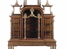 A George II parcel-gilt padouk cabinet-on-stand, attributed to Thomas Chippendale
