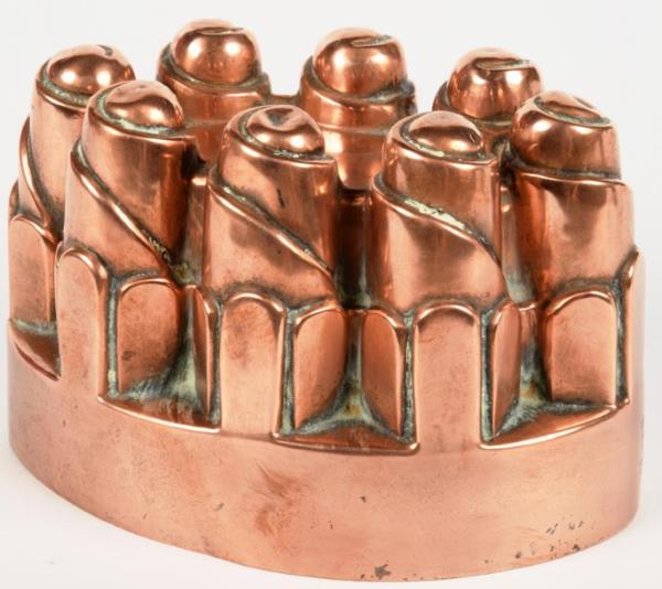 An Oval Copper Jelly Mould Of Turret Form By Benham Froud