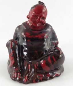 A Royal Doulton figure Seated Buddha in a Sung glaze circa 1920