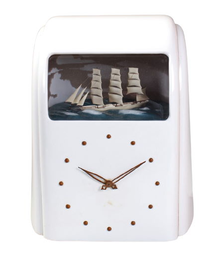 white case Vitascope clock with gold dial