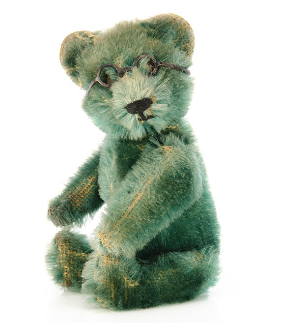 A rare Schuco emerald green mohair teddy bear perfume bottle with rare gold jewelled eyes and black painted metal framed glasses