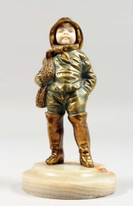 Georges Omerth a bronze and ivory figure The Young Fireman