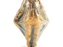Georges Omerth a patinated bronze and ivory figure of a boy clown numbered 8446