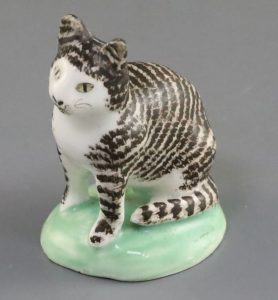 lowestoft porcelain tabby cat on green base