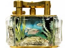 A Dunhill Aquarium table lighter by Ben Shillingford featuring fish rocks and weeds