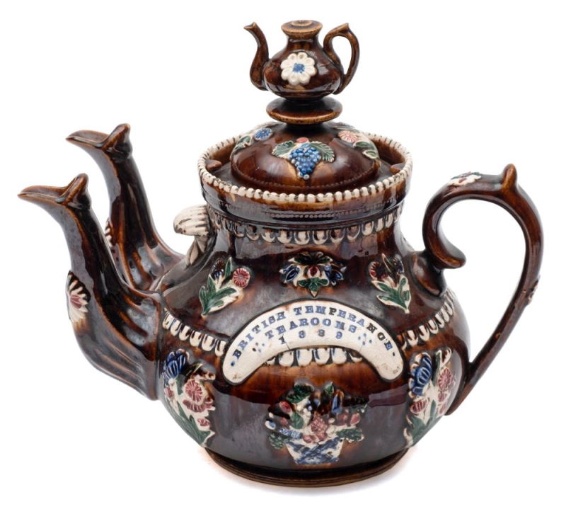 A Measham bargeware double spouted teapot impressed British Temperance Tearooms 1889