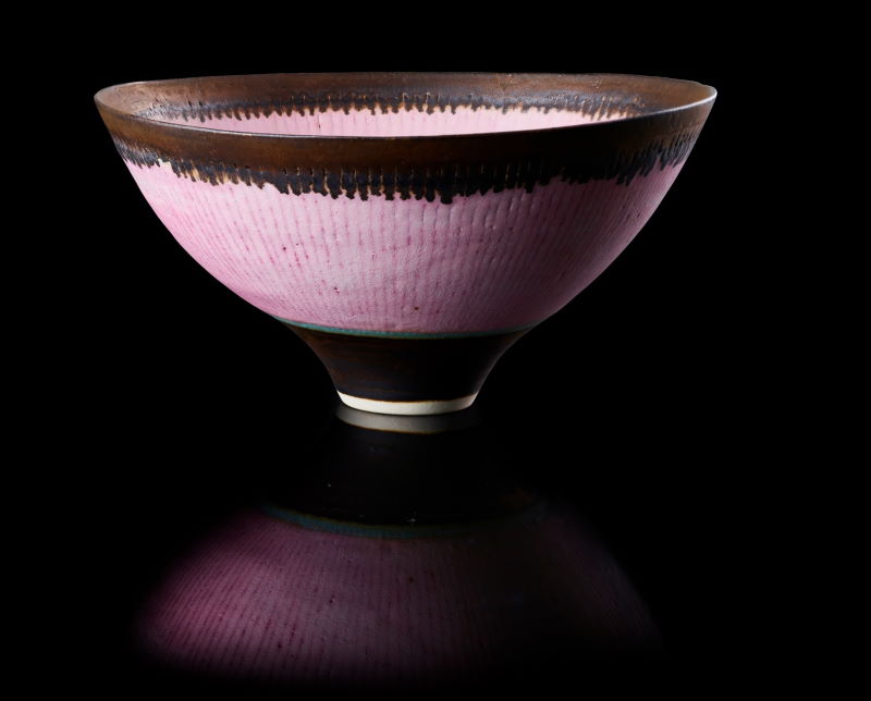 Dame Lucie Rie Footed bowl circa 1980 porcelain with a pink glaze turquoise banding sgraffito design and a bronzed rim and inner well