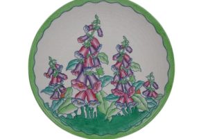 A large 1930s Crown Ducal wall plaque designed by Charlotte Rhead in the 4953 Foxglove pattern