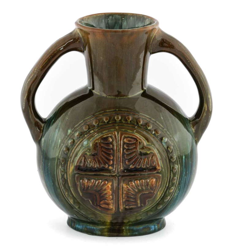 Christopher Dresser for Linthorpe Pottery A Twin-Handled Vase moulded with Aztec motifs