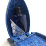 A Bourjois bakelite perfume container in the form of an owl showing open container with bottle