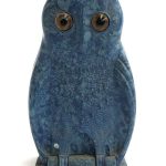 A Bourjois bakelite perfume container in the form of an owl with bottle front view
