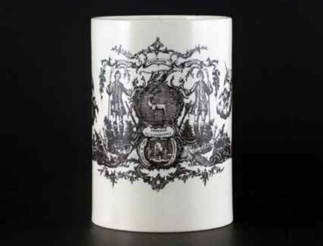 A Wedgwood cream-ware cylindrical mug printed in black with shield panel and mottos for the Ancient Order of the Bucks