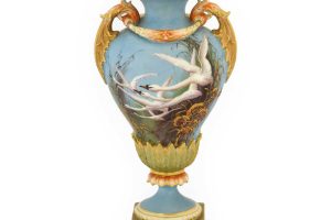 A Royal Worcester Porcelain Vase by Charles Baldwyn 1899 painted with flying swans