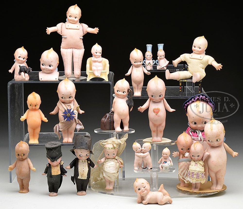 A collection of various Kewpie Dolls