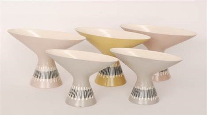 A set of five graduated Hornsea Slipware vases designed by John Clappison, each of conical form with a flared collar neck