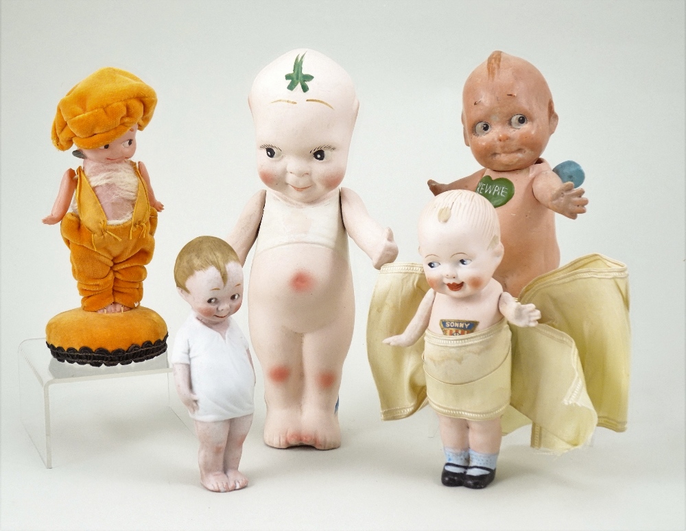 Collection of five various Kewpie type dolls including a Nippon all bisque Sonny doll with painted features