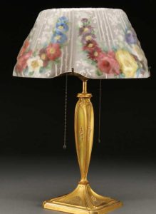 A Pairpoint Puffy Reverse Painted Table Lamp with garland of flower design