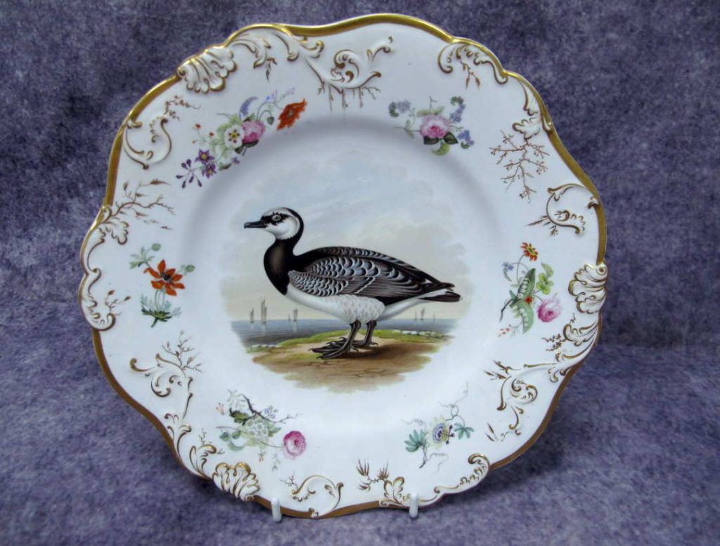 A Rockingham Porcelain Plate the centre painted with an ornithological study of a Barnacle Goose