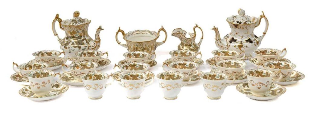 A Rockingham Porcelain Tea and Coffee Service circa 1830 painted in grey and gilt with leaf scrolls printed mark in puce
