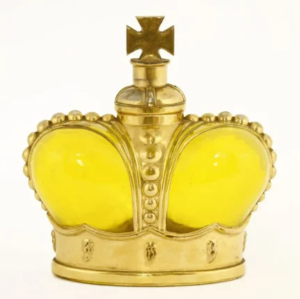 A Prince Matchabelli yellow moulded glass scent bottle modelled as a crown