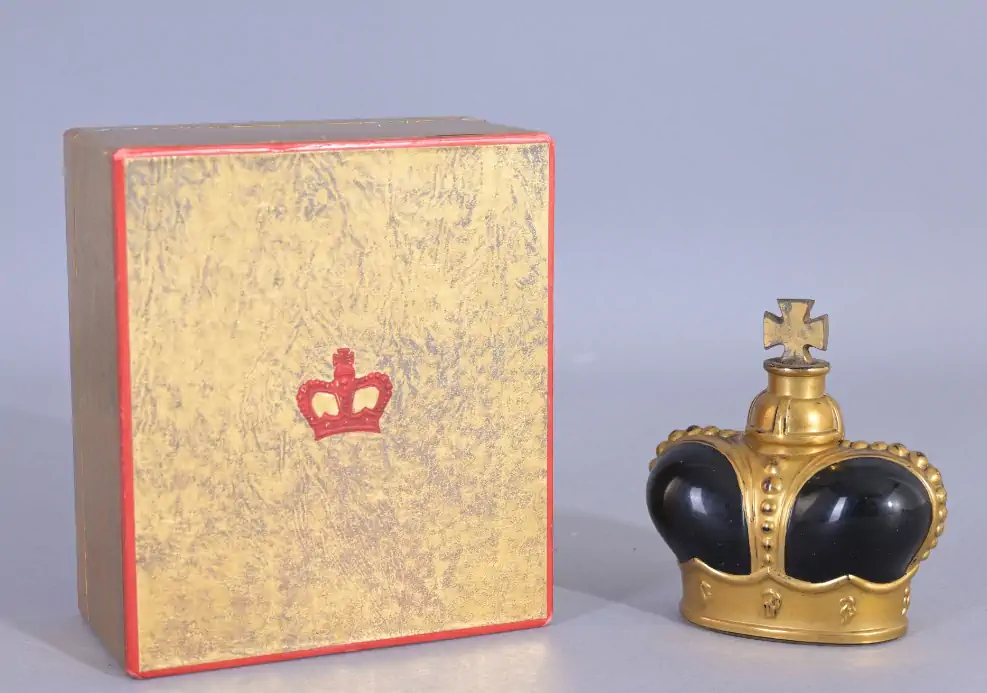 Prince Matchabelli a black crown perfume bottle with gold box and red trim
